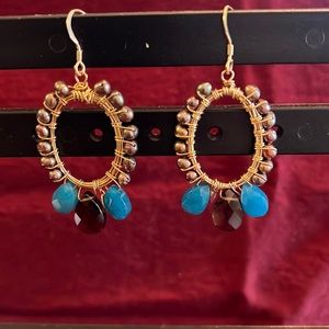 Pearl, citrine and cabochons.